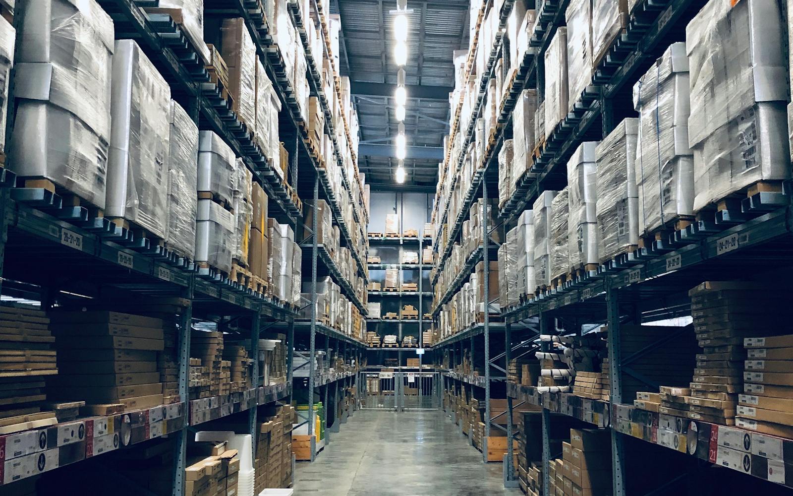 Warehouse racking stocked with packaging supplies